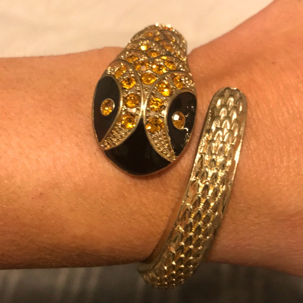 Serpent hinged bracelet with much bling